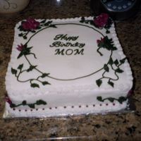 Andrea's Mil Cake I made this cake for a friend's MIL. This cake had one chocolate layer and one white layer and was decorated in buttercream.