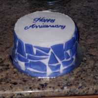 Anniversary Cake I made this cake for my dh and me for our 2nd wedding anniversary. This was a 6 in lemon cake frosted in buttercream with purple fondant...