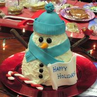 Snowman Cake I made this somewhat on the fly for a charity auction. It's actually two cakes baked in a 3-D tree pan that I stood upright and held...