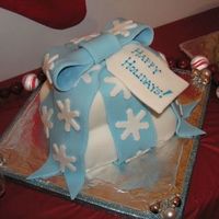 Happy Holidays Gift Stack This was the first time I had ever decorated with fondant. It was also the first time I had ever created a tiered/stacked cake with dowel...