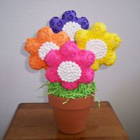 100_0485.jpg My first cookie bouquet. It sold like hotcakes at a bake sale. I was very proud of my self. If only I could get my cakes to look as good as...