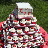 Red And White Cupcake Tree Top cake was a 6 inch square Coconut Vanilla bean cake with fresh strawberries. Butter cream frosting, fondant letters. The cupcakes are...
