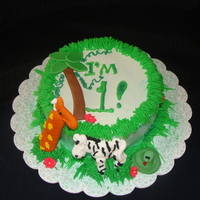 Zachary's Smash Cake 6 inch vanilla cake with whipped frosting, fondant accents and royal icing animals