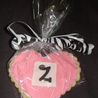 Zoey's Cookies NFSC with fondant accents... These were the favors for a baby shower. They matched the zebra baby shower cake.