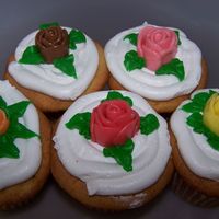 Starburst Roses I made these because my son wanted cupcakes and I wanted to practice making starburst roses. I thought they turned out pretty good.