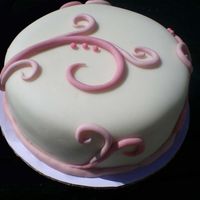 Pink And White Chocolate cake covered with fondant