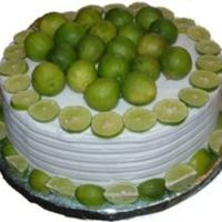 Key Lime Cake Simple buttercream cake with a designed side and key lime decorations.