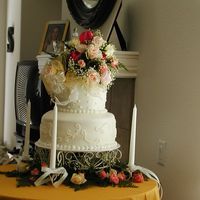 My First Paid Wedding Cake This was for a small 2nd wedding. Bottom was 12" triple choc, w/ chocl mousse. Top was french vanilla w/ raspberry filling. Top was...