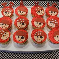 Pirate Themed Cupcakes For A Baby Boy WASC with mango filling, iced in buttercream. All pirate decorations are made from gumpaste.