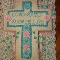 Communion Cross Pretty self explanatory...lol. The roses are pre -bought and the icing is whipped cream.