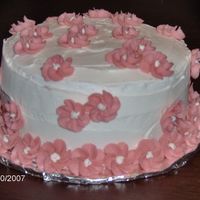 Pink Drop Flowers Easy cake, my 2nd in my first class. I made drop flowers, froze them and placed them on the cake!