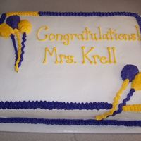 100_3510.jpg buttercream icing; balloons have edible glitter/cake sparkles on them.