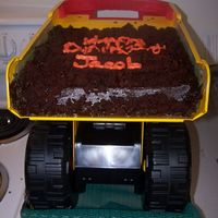 Dump Truck Cake tonka dump truck with chocolate cake and chocolate buttercream; the mom didn't want the writing very neat since it was a dump truck...