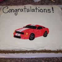 100_3303.jpg Carrot cake with cream cheese frosting. The mustang is made out of fondant that I painted.