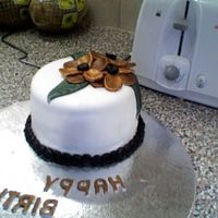 Bronze Flowers i made this little treat for a friend's 22nd birthday. its marble cake with a yummy choc frosting. all fondant decorations... i took...