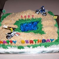Day At The Dirt Track! A birthday cake for the neighbor! This cake was &frac12; vanilla &frac12; chocolate. The ramps were made of cup-cake smashed...