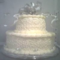 25Th Anniversary Cake This is for my boyfriends Aunt & Uncle. She wanted a 2 layer chocolate cake w/ cream cheese icing and a silver bow on top. I wanted...