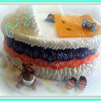 Baby Shower Colors are for Chicago Bears fan. Fondant baby, pacifier,blanket, baby shoes and teddy bear. Chocolate baby bottle. Lots of ideas from CC...