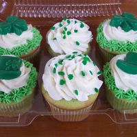 100_5383.jpg Green cupcakes with Buttercream Frosting and molded chocolate candy.
