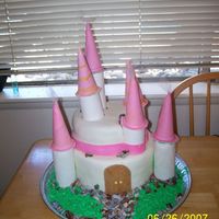 Princess Castle Cake Princess Cake with purple tulle on the tips of the towers.