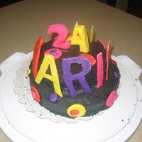 Sister's Bday Cake Cake is cheese cake with guava filling. Black buttercream frosting, fondant everything else.