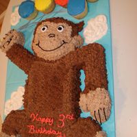 Curious George Made out of carved cake & frosted with buttercream.