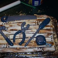 Fahter's Day Tool Bench I used devil food chocolate cake, with chocolate frosting and grahm crackers crushed for the 'saw dust', The tools, wood planks...