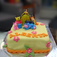Pooh And Friends Exept for Princess Belle's figurine, everything was made of rolled fondant.