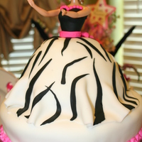 Zebra Print Barbie Cake White cake in the Doll cake mold. I replaced the tacky looking head on the pick with a real Barbie head. It's on a 10 inch chocolate...
