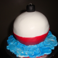 Fishing Bobber Fishing bobber cake iced in buttercream with black fondant topper.