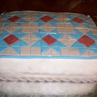 Gramma's Quilt Cake This was my Gramma's birthday cake and I wasn't at all impressed with my results. Perhaps it will spark some ideas for others.