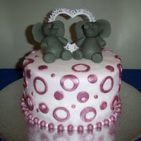Brenda's Elephant Cake This was a shower cake for a friend's sister. The figures are all fondant. Decorations are all fondant and hand painted with lustre...