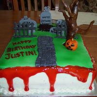 Halloween Birthday Cake BC with Fondant/Gumpaste headstones and tree. Fence is RI. Had fun with this one. Blood is colored piping gel.