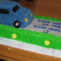 Going Away Cake For Co-Worker 2 9x13 chocolate cakes with oreo pudding filling and a 2mix vanilla carcake made with the cruisin car cake pan. I made it for a co-worker...