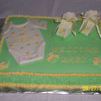 Onsie And Baby Booties 11x15 yellow cake with BC and fondant decorations. Thanks to all the CCers for the great ideas and especially to llee.