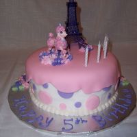 Pink Poodle In Paris BC with fondant decorations.