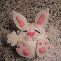 Bunny Cupcake Saw this in the Wilton Cupcake Fun book. Used Royal Icing for hands, feet and ears. Thanks for looking!