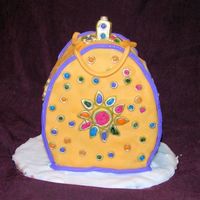 Jewel Purse Cake I saw this on another site and I really like the jewl thing. My jewels were perfect and drying until my daughter dumped the tray I had made...