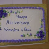 Anniversay Cake White Cake w/ strawberry filling. Frosted w/ pastry pride and buttercream borders, flowers