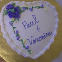 Anniversary Cake White cake w/ strawberry filling. Frosted w/ pastry pride w/ buttercream flowers, borders