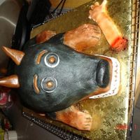 Cakes By Tonya sheet cake, 6" round 1/2 sport ball carved into a dog. The ears, eyes, tail are tooies roll. the arm is bc. For a friend at work. He...