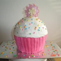 Cakes By Tonya big cupcake, wilton pan. not sure if I like it. Topper is chocolate TFL