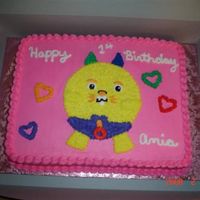 Cakes By Tonya 11x15 1st birthday with the little girls toy on top