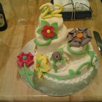 Fantasy Flowers the cakes are all white chocolate mud cakes covered in white chocolate mmf. the flowers are all mmf, this was inspired by a cake done by...