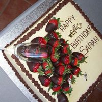 Sarah's 21St Cake vanilla cake filled with whipped cream and fresh strawberries and covered in vanilla icing. strawberries were dipped in dark choc prior to...