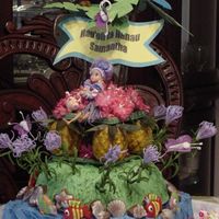 Aloha Luau Birthday Cake This is round on top of a square, iced in buttercream. The topper is hand made except for the doll, which was store bought and converted...