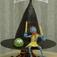 Terry Pratchett's Wee Free Men This cake illustrates one of Terry Pratchett's Discworld novels, THE WEE FREE MEN. The witch hat is graduating rounds carved and iced...