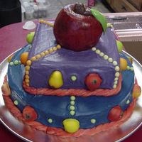 Kitchen Fruit Theme Yellow sour cream cake with buttercream filling and icing. The apple on top is two mini bundt pans and the apple was hand painted after the...