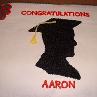 Graduation Cake For Aaron B. This cake was huge! It was a ful sheet, double layer, half yellow, half strawberry. It was iced with buttercream. Yum!