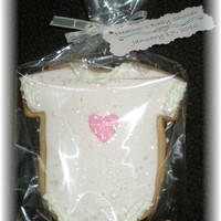 Onesie Cookie.. NFSC with fondant and royal accents..